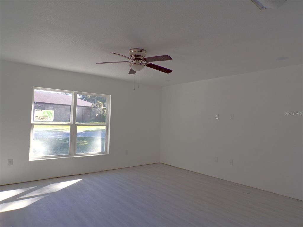 4341 Northwest 154th Street Reddick, FL 32686 - Photo 8 of 11 Open floor plan with ceiling fans