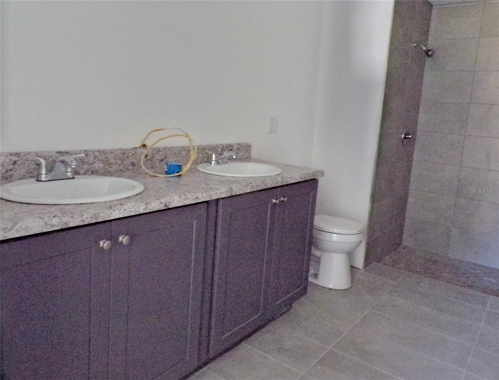 4341 Northwest 154th Street Reddick, FL 32686 - Photo 9 of 11 Double Sink, tile floor and shower in Master Suite