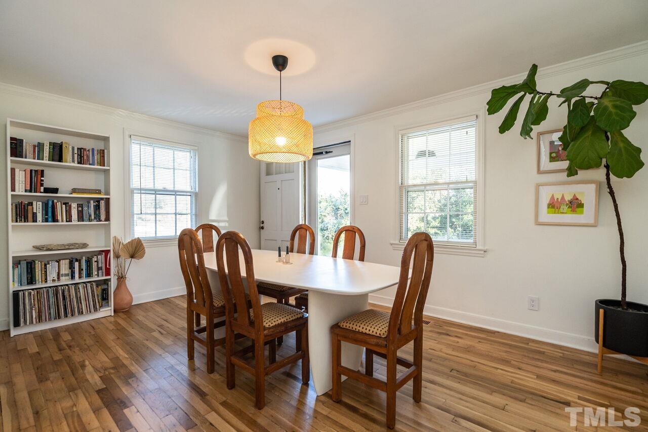 408 North King Charles Road Raleigh, NC 27610 - Photo 5 of 26 a view of a dining room with furniture and a window