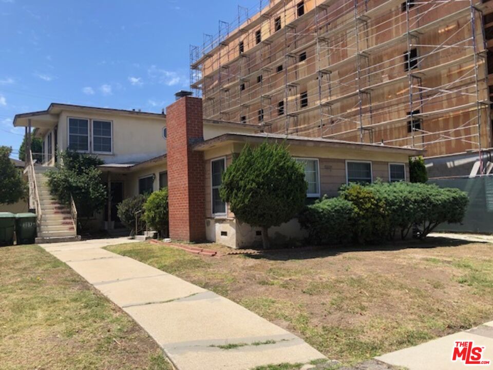8837 Ramsgate Avenue Los Angeles, CA 90045 - Photo 2 of 3 a view of a building with a yard