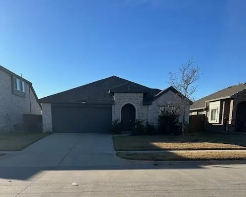 a front view of a house with yard