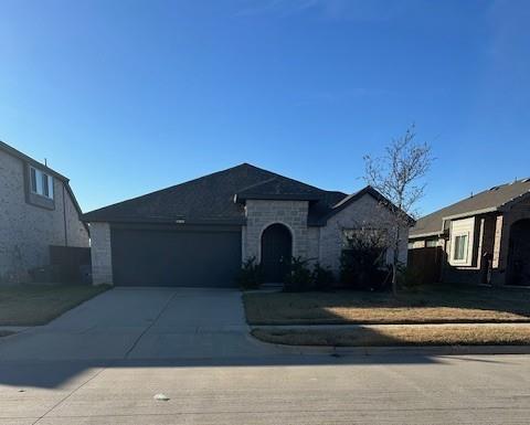505 Bermuda Avenue Lancaster, TX 75146 - Photo 2 of 17 a front view of a house with a garden