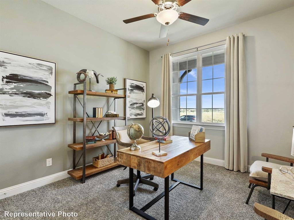 1143 Rothland Lane Red Oak, TX 75154 - Photo 18 of 18 Room featuring a large window, a ceiling fan with integrated lighting, and neutral wall tones