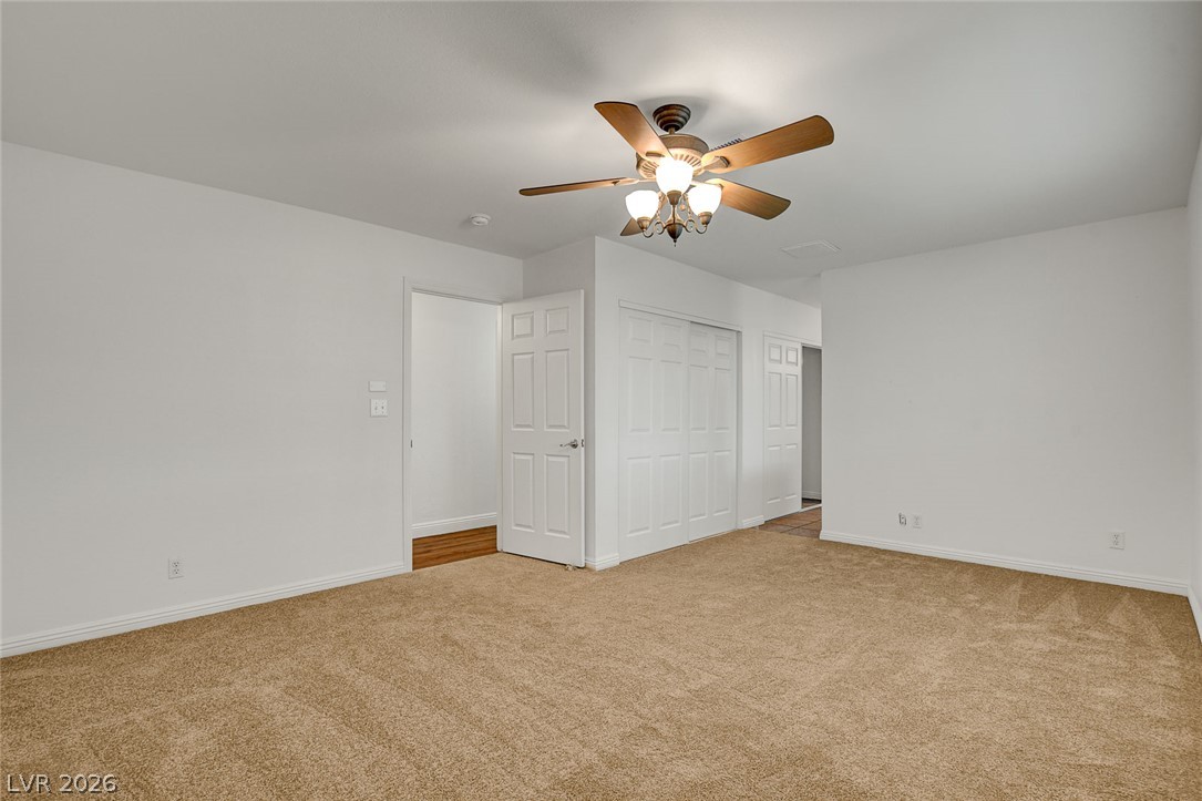 1810 Pinto Road Henderson, NV 89002 - Photo 36 of 53 Well-lit living area features a convenient ceiling fan and ample closet space.