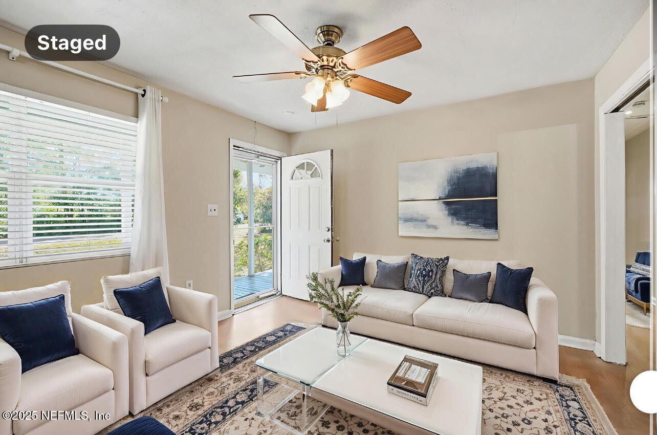 11948 Aaron Road Jacksonville, FL 32218 - Photo 2 of 33 a living room with furniture and a large window