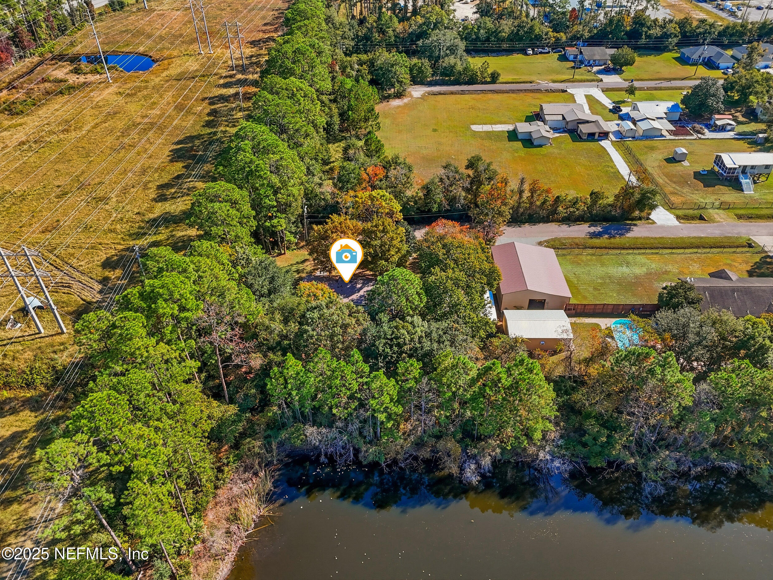 11948 Aaron Road Jacksonville, FL 32218 - Photo 32 of 33 an aerial view of a house with a lake view