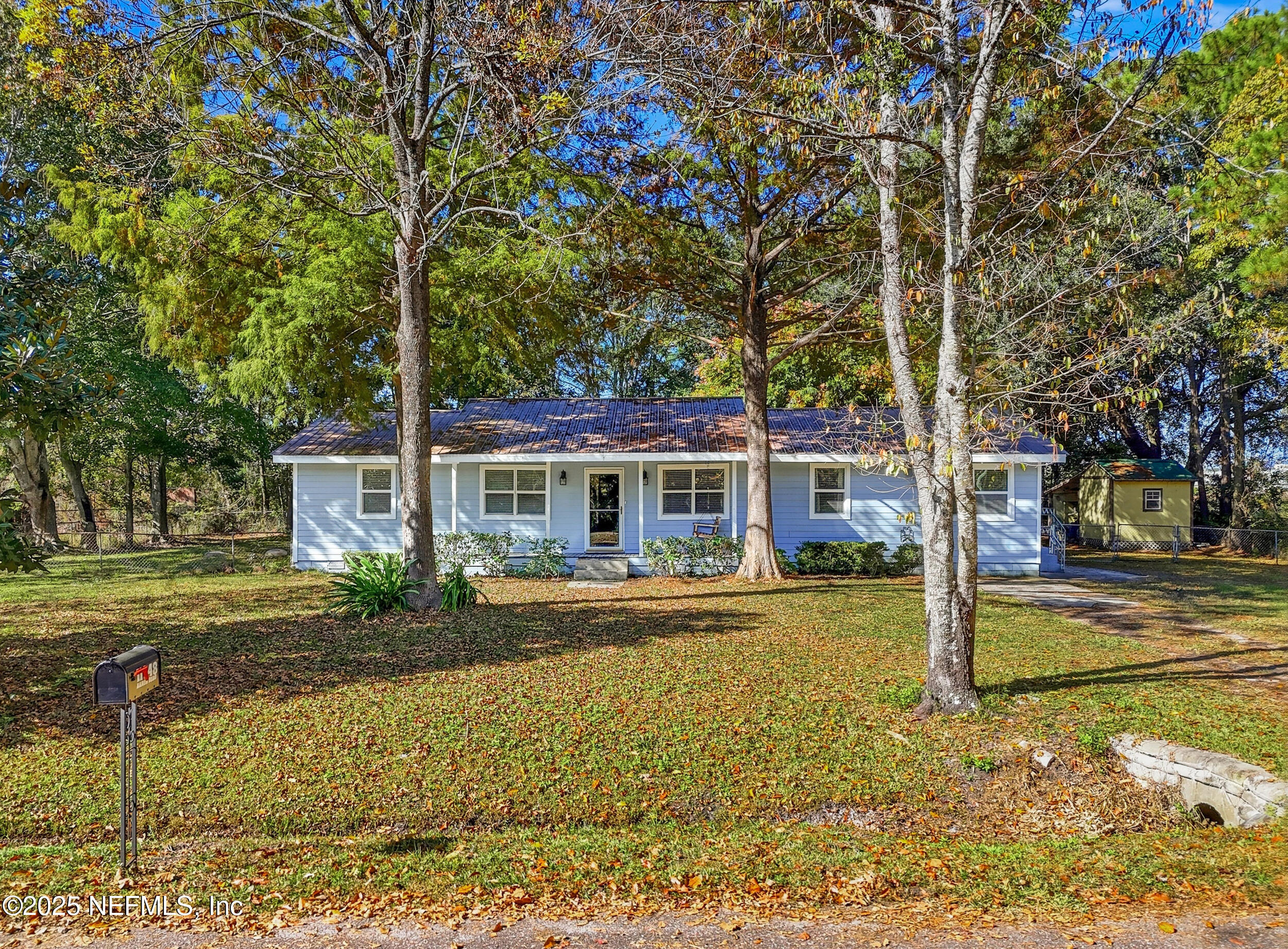 11948 Aaron Road Jacksonville, FL 32218 - Photo 8 of 33 a front view of a house with garden