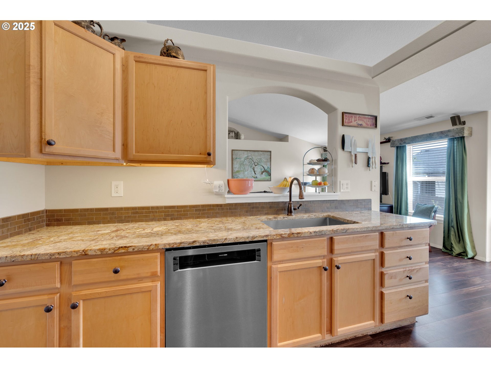 6057 Pebble Court Springfield, OR 97478 - Photo 14 of 42 a kitchen with cabinets appliances and a counter top