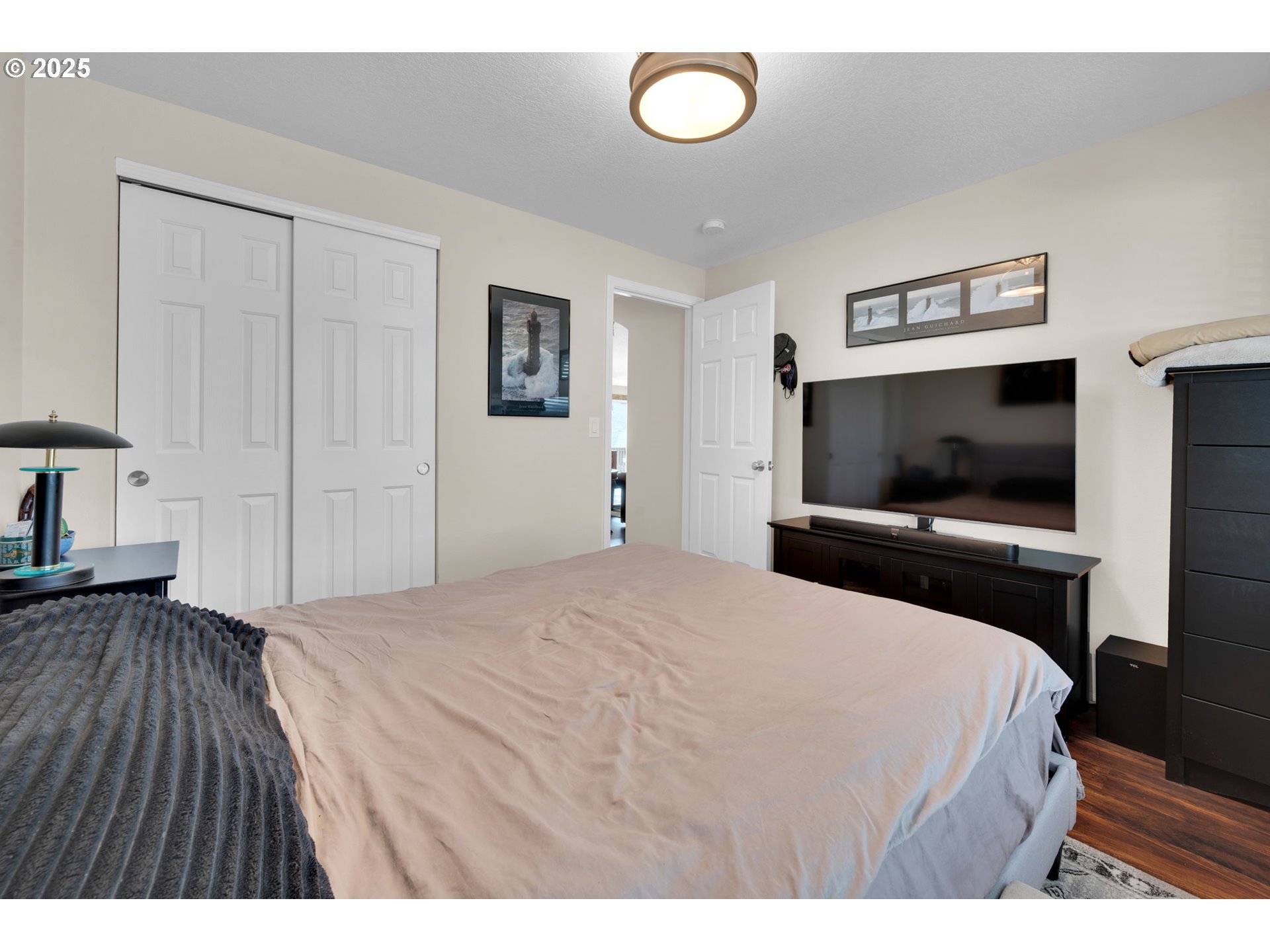 6057 Pebble Court Springfield, OR 97478 - Photo 19 of 42 a bedroom with a bed and a flat screen tv