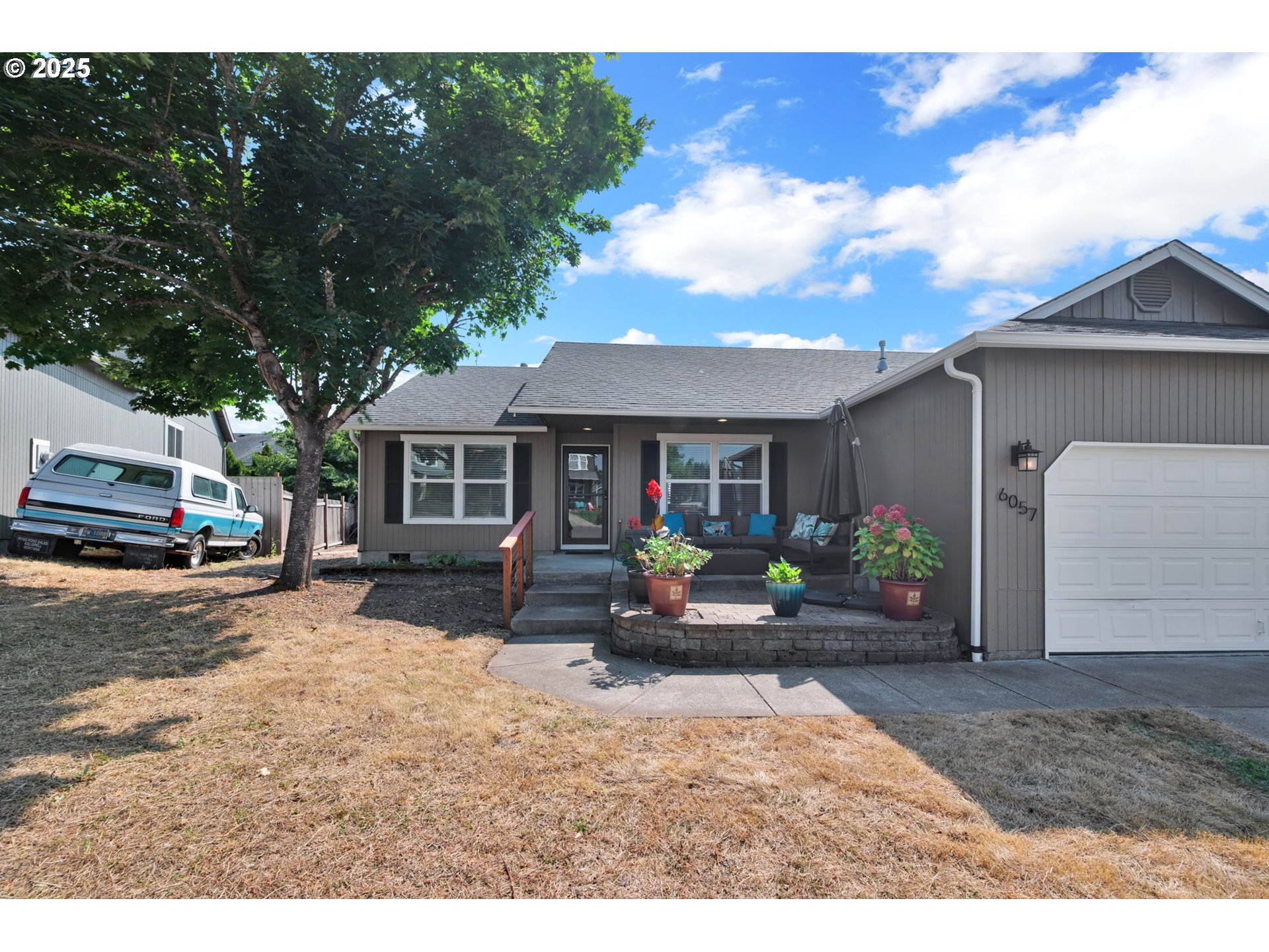 6057 Pebble Court Springfield, OR 97478 - Photo 2 of 42 a view of a house with patio