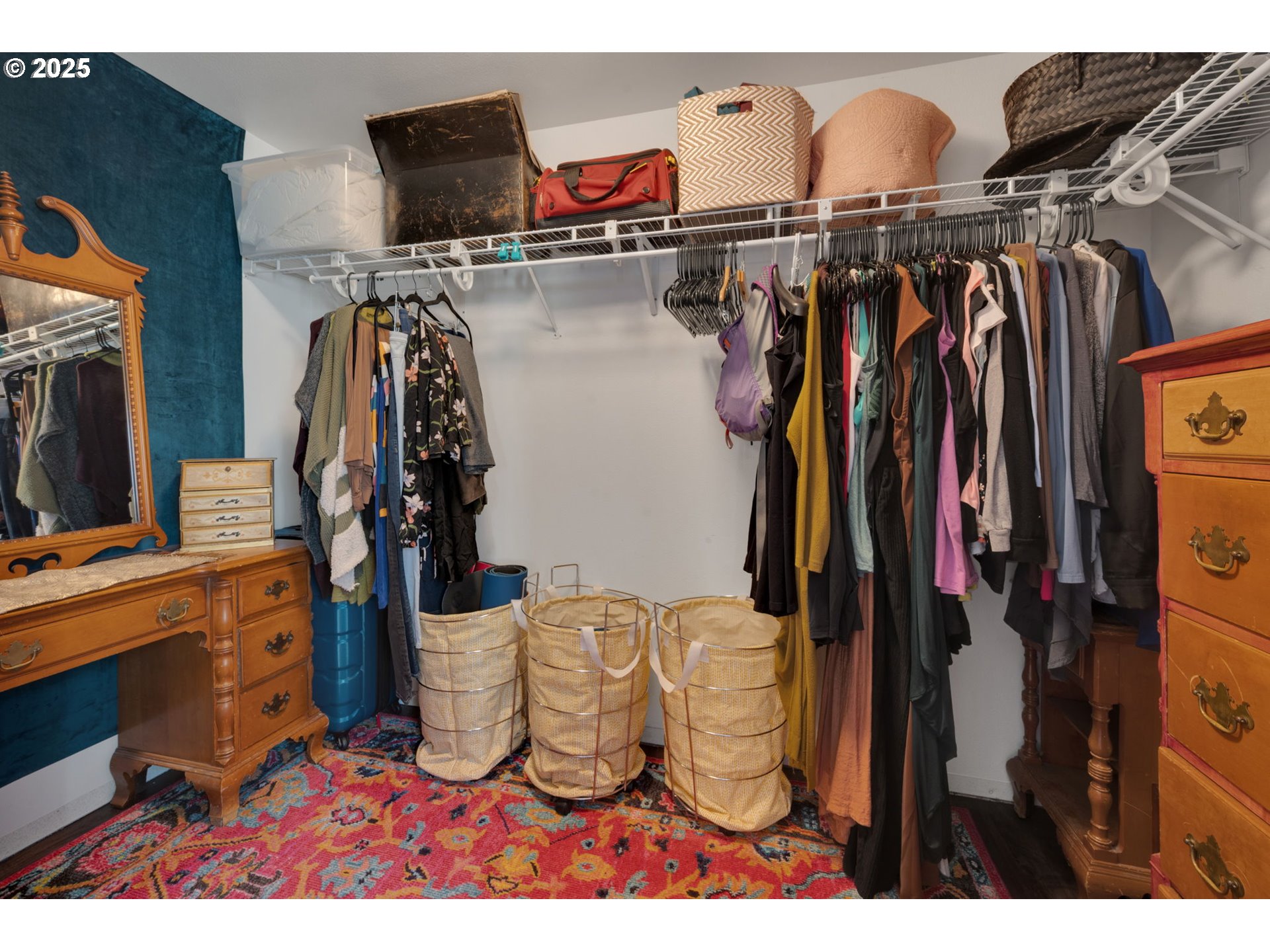 6057 Pebble Court Springfield, OR 97478 - Photo 35 of 42 a view of walk in closet with clothes and shoes