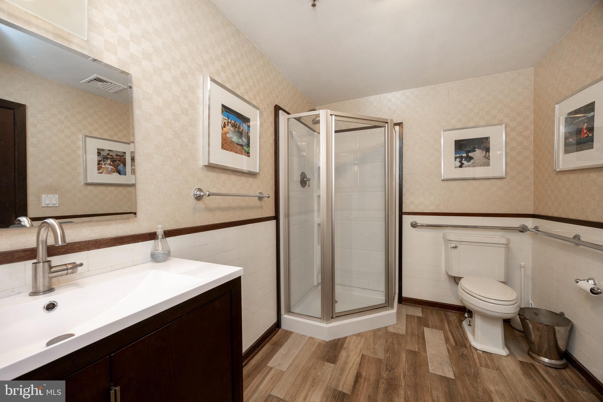 232 Conestoga Road Wayne, PA 19087 - Photo 17 of 34 a bathroom with a toilet sink and shower