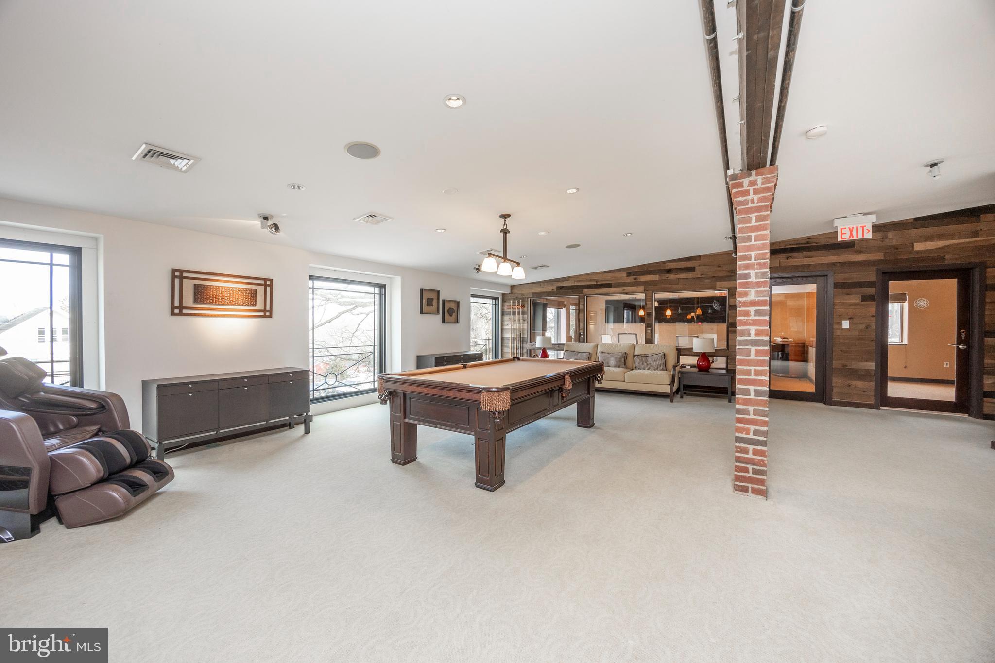 232 Conestoga Road Wayne, PA 19087 - Photo 18 of 34 a living room with furniture a window and a flat screen tv