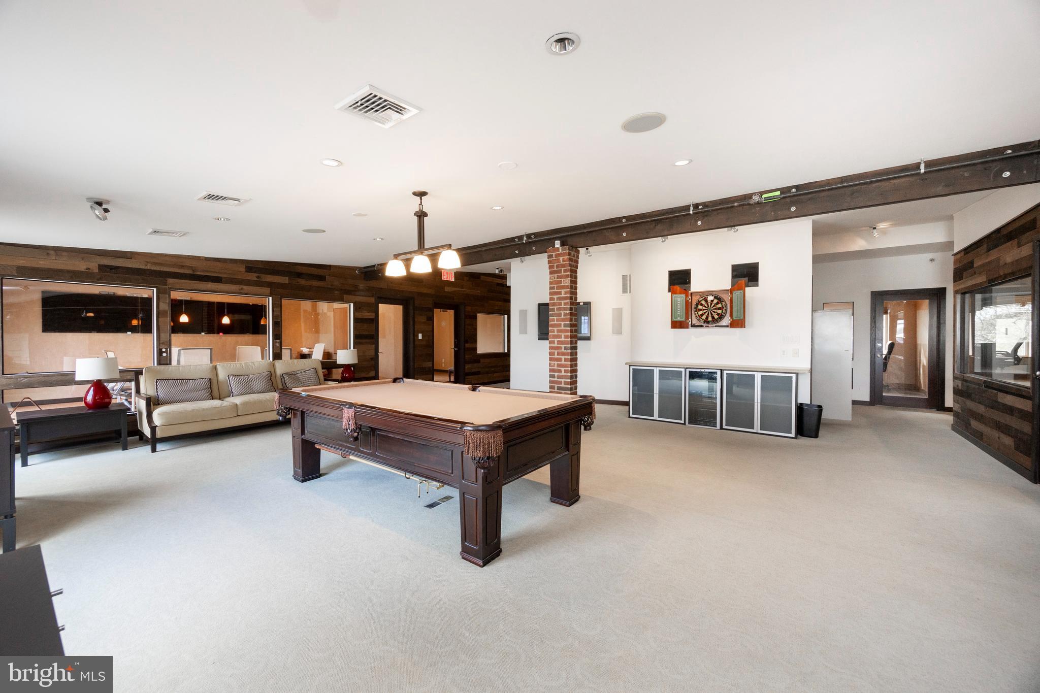 232 Conestoga Road Wayne, PA 19087 - Photo 19 of 34 a living room with furniture and a table