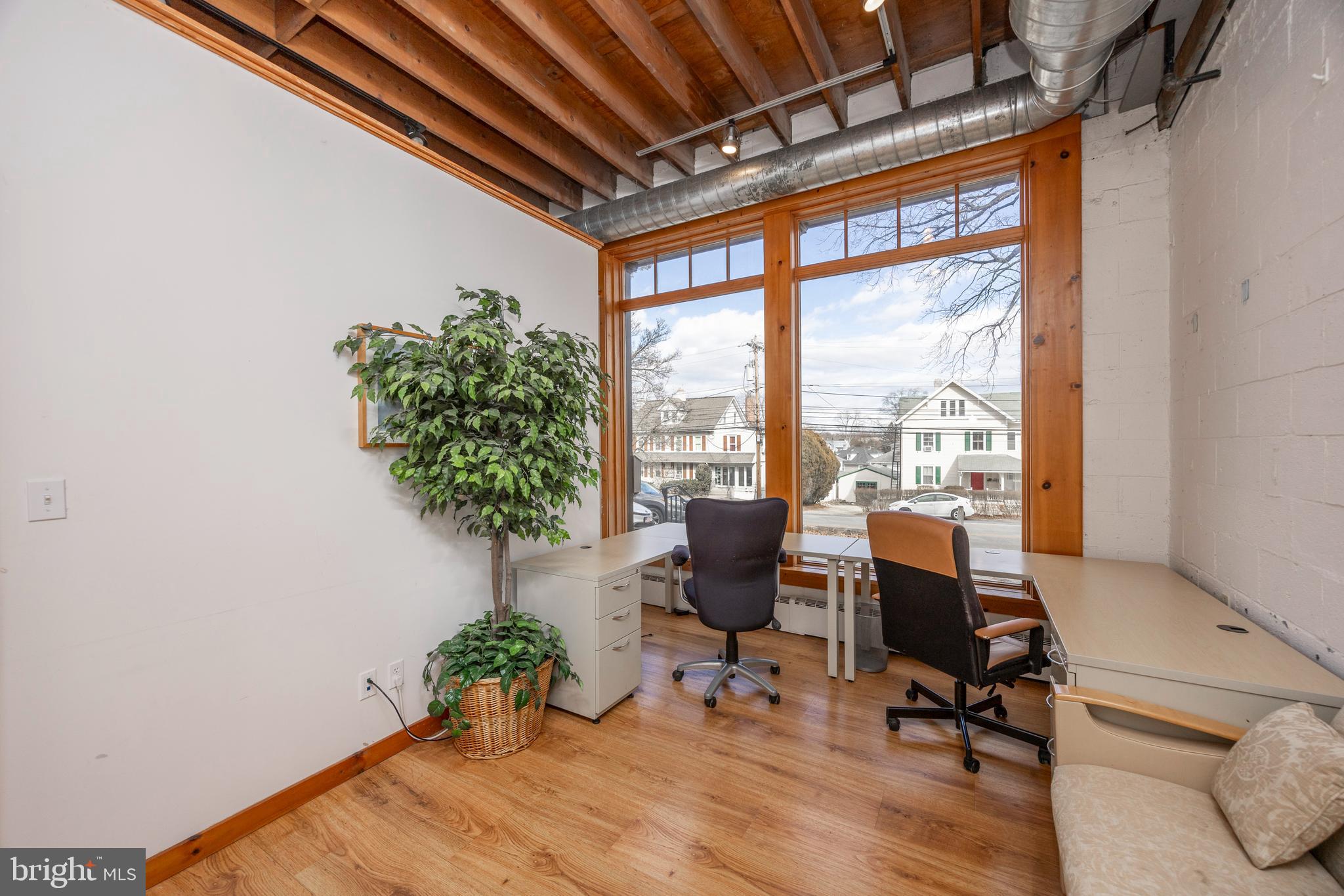 232 Conestoga Road Wayne, PA 19087 - Photo 22 of 34 a view of a livingroom with workspace and a window