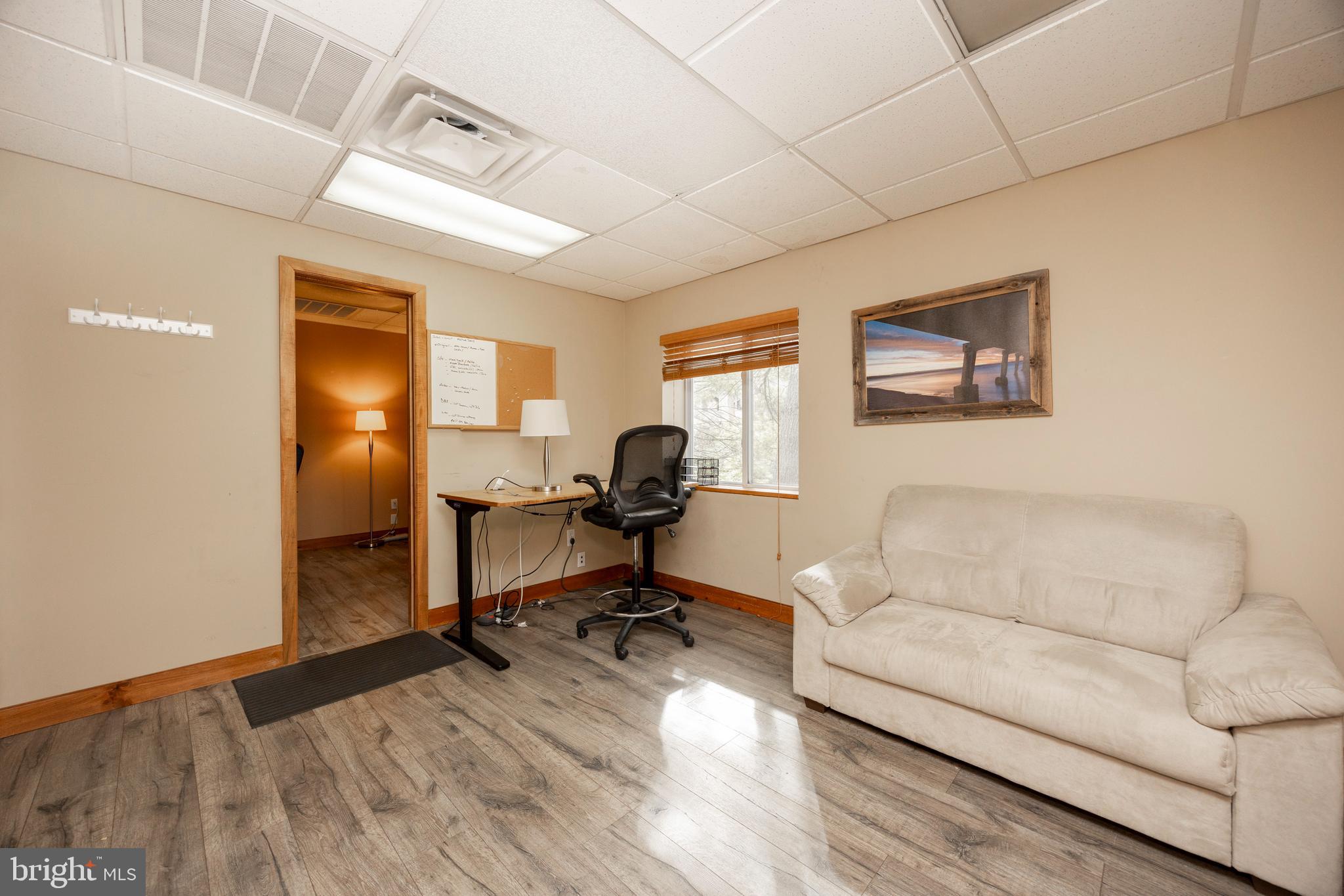 232 Conestoga Road Wayne, PA 19087 - Photo 9 of 34 a living room with furniture and a window