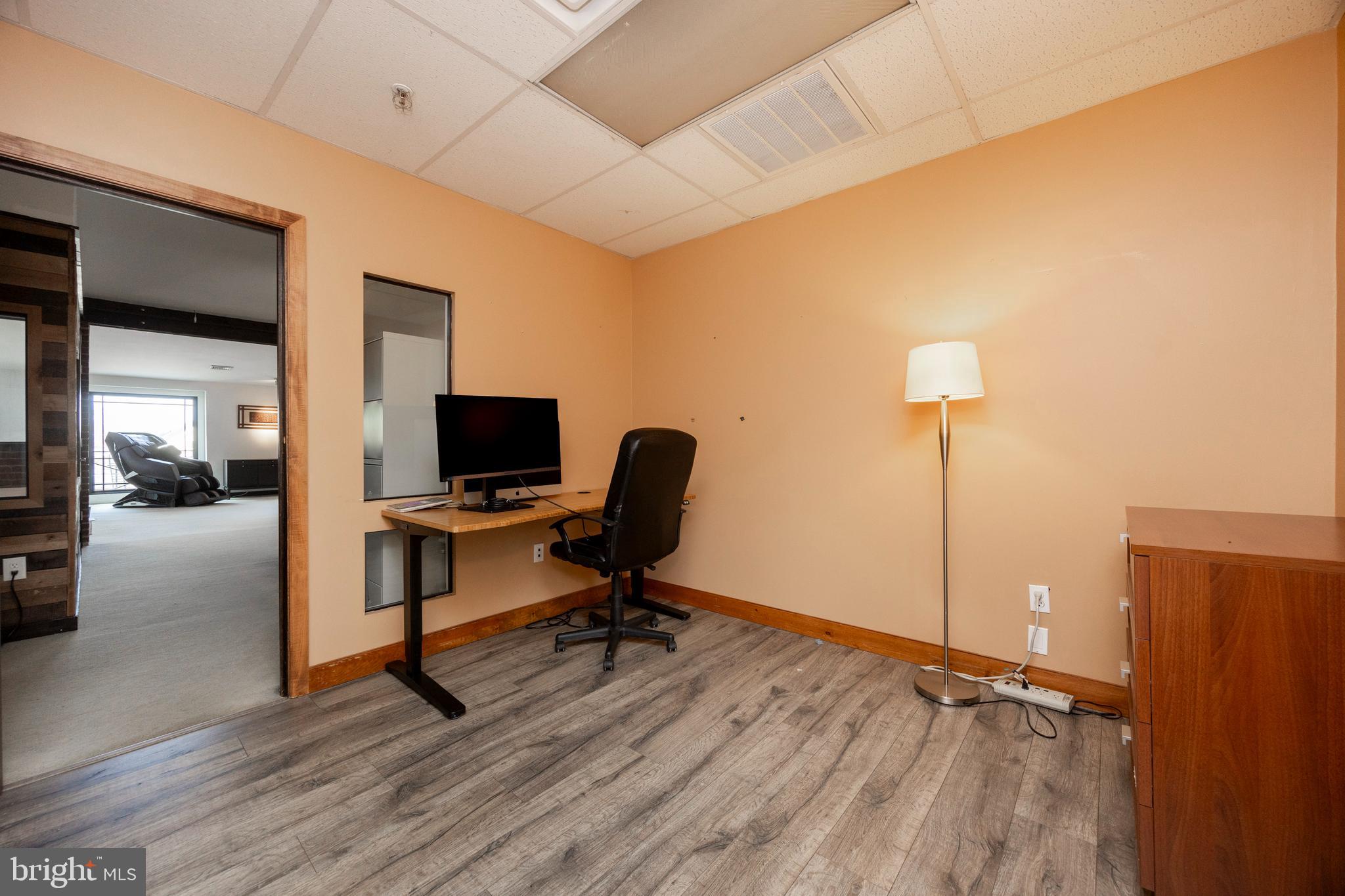 232 Conestoga Road Wayne, PA 19087 - Photo 10 of 34 a view of a workspace with furniture and a window