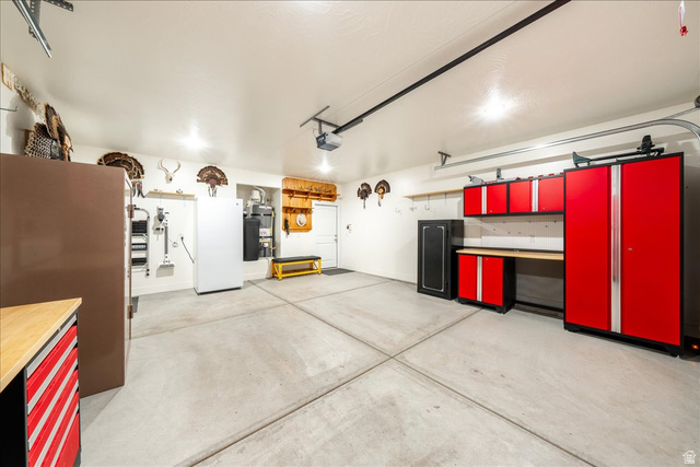 357 East Main Street Enterprise, UT 84725 - Photo 44 of 71 Garage with water heater and freestanding refrigerator