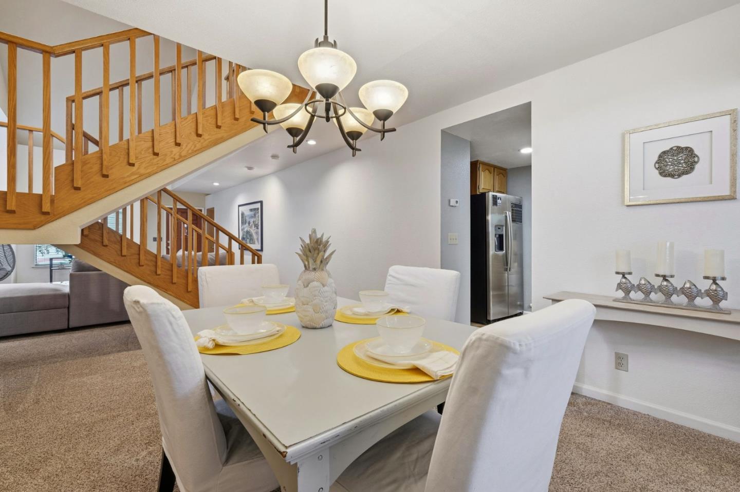 303 Dry Creek Road Aptos, CA 95003 - Photo 17 of 41 a view of a dining room with furniture and a chandelier