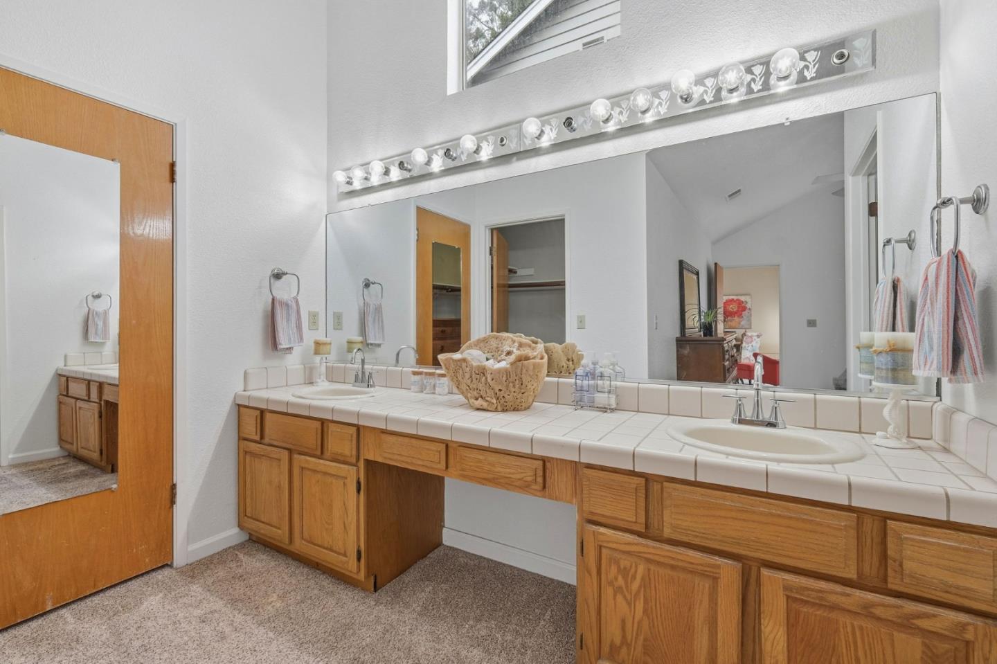 303 Dry Creek Road Aptos, CA 95003 - Photo 30 of 41 a bathroom with a granite countertop sink and a mirror