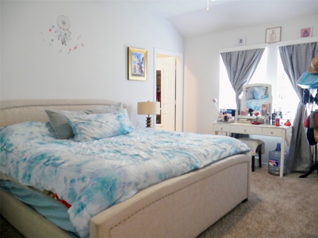 524 Taggart Trail Jarrell, TX 76537 - Photo 11 of 18 a bedroom with a bed and a window