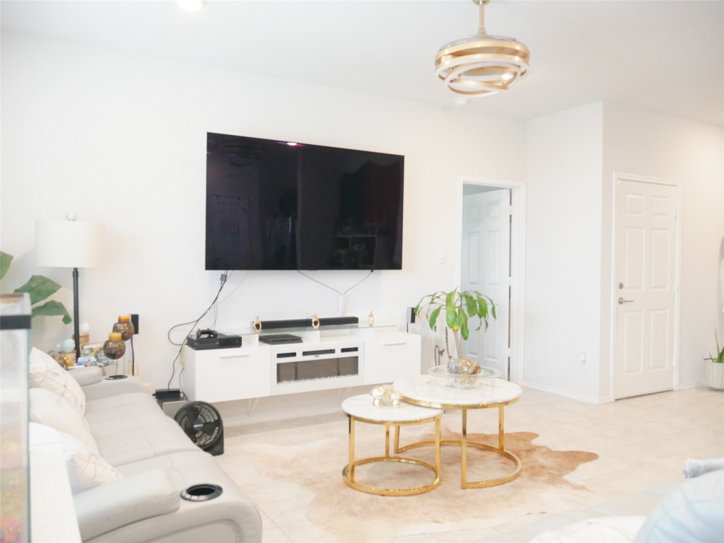 524 Taggart Trail Jarrell, TX 76537 - Photo 5 of 18 a living room with furniture a rug and white walls