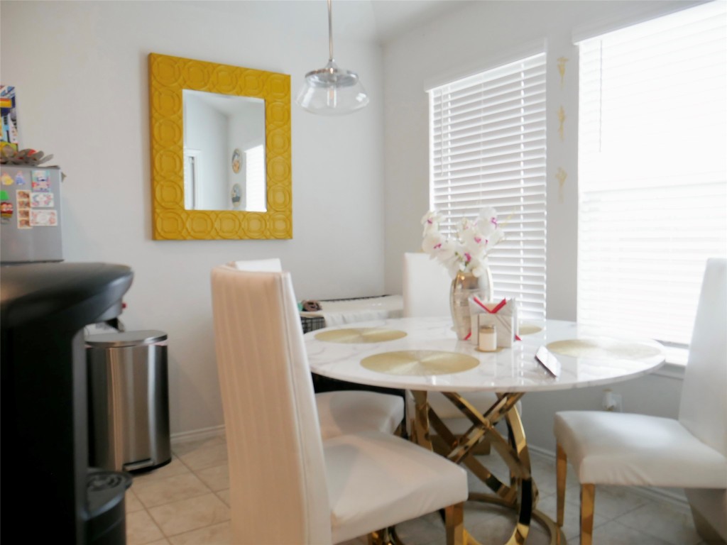 524 Taggart Trail Jarrell, TX 76537 - Photo 10 of 18 a view of a dining room with furniture and a window