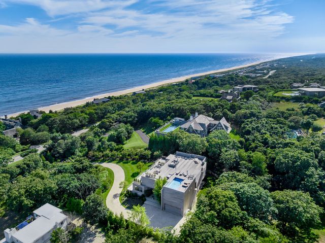 an aerial view of a house with a garden
