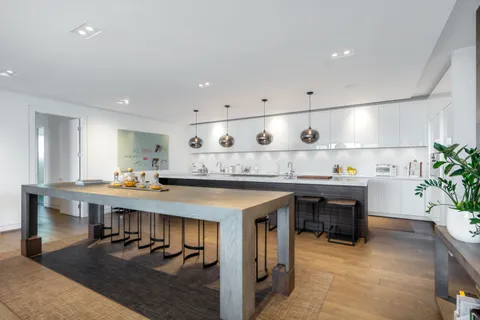 a kitchen with a table and chairs in it