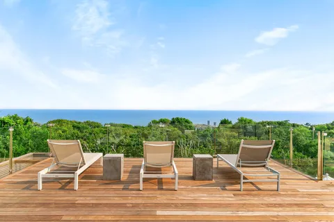 a view of a chairs and table on the terrace
