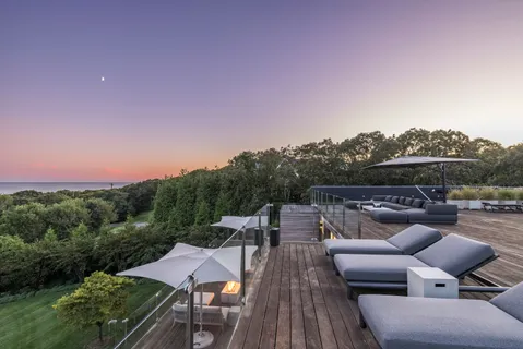 a view of a terrace with sitting area