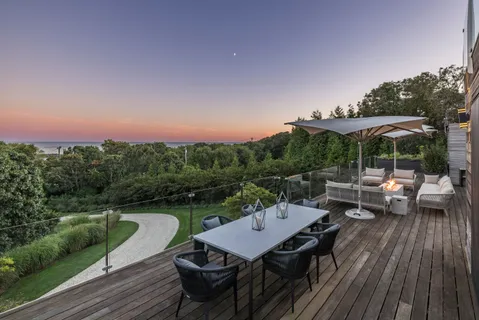 an outdoor space with furniture and umbrella