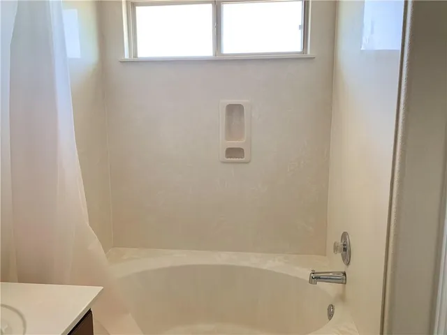 a bathroom with a bathtub