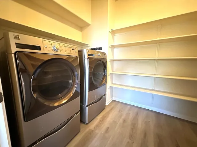 a utility room with washing machine