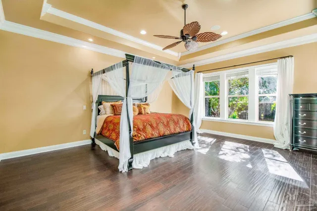 a spacious bathroom with a tub sink and mirror