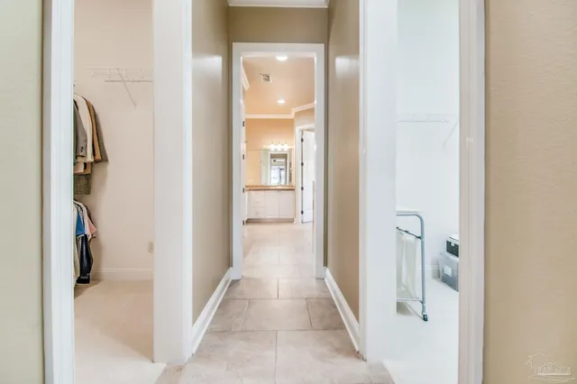 a white bath tub sitting in a bathroom next to a window
