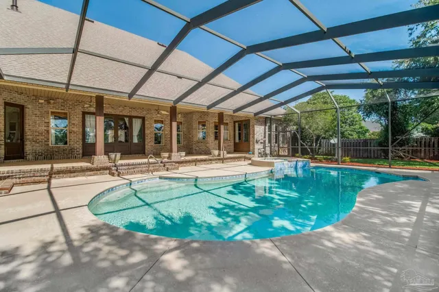 a view of a swimming pool with a patio