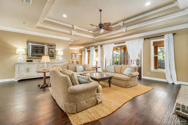 a living room with fireplace furniture and a wooden floor