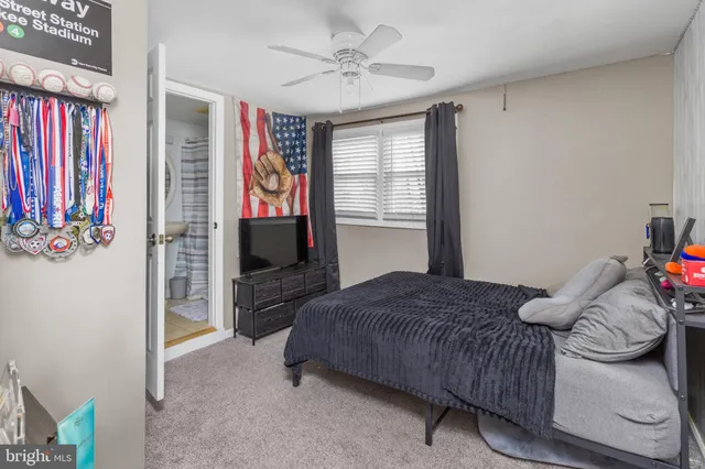 a bathroom with a toilet a sink and a mirror