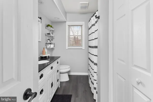 a bedroom with a bed and a table