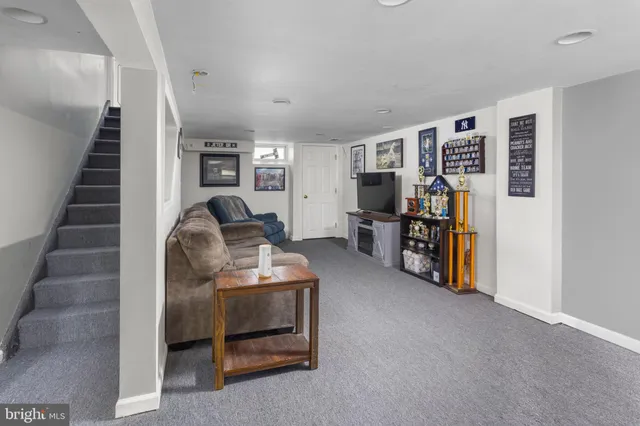 a living room with furniture and a couch