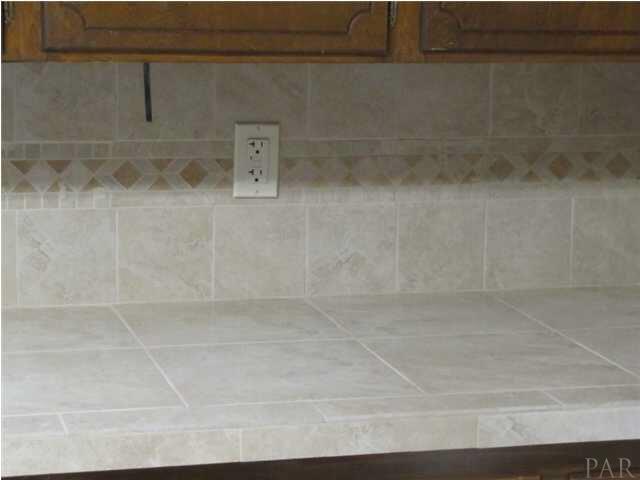 1025 Commonwealth Road Pensacola, FL 32504 - Photo 15 of 25 New tile counter top with tile back splash