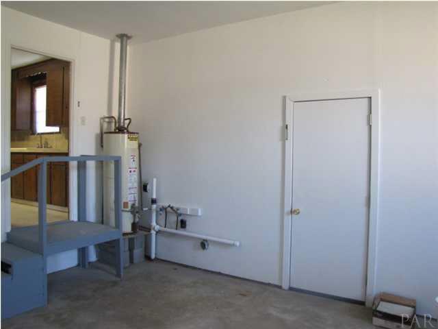1025 Commonwealth Road Pensacola, FL 32504 - Photo 22 of 25 back side of garage with washer/dryer area