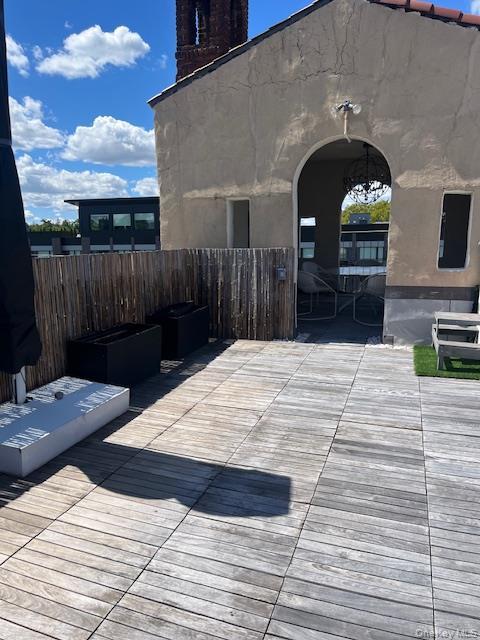 215 Middle Neck Road, Unit 13A Great Neck, NY 11021 - Photo 13 of 20 a close view of a dinning table and chairs in the patio