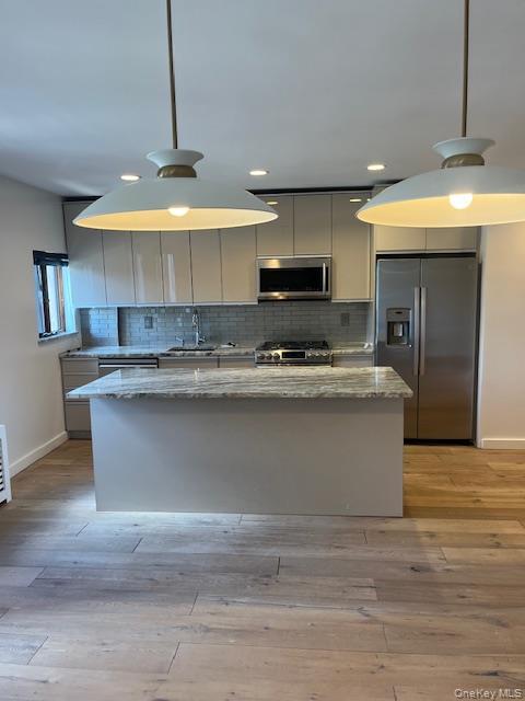 215 Middle Neck Road, Unit 13A Great Neck, NY 11021 - Photo 3 of 20 a view of kitchen with stainless steel appliances granite countertop stove top oven and cabinets