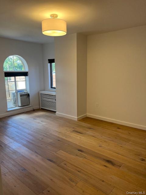 215 Middle Neck Road, Unit 13A Great Neck, NY 11021 - Photo 7 of 20 a view of empty room with wooden floor and fan