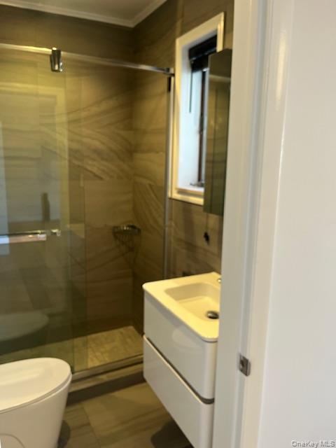 215 Middle Neck Road, Unit 13A Great Neck, NY 11021 - Photo 9 of 20 a bathroom with a sink a toilet and shower