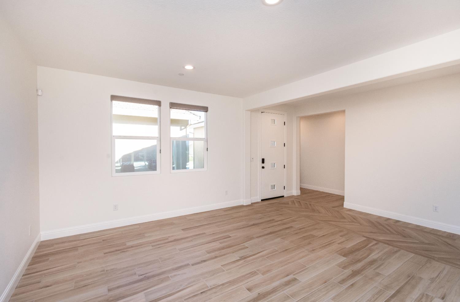 124 Basile Court Lincoln, CA 95648 - Photo 18 of 55 empty room featuring light wood-type flooring and recessed lighting