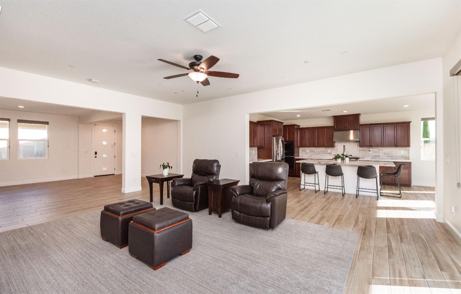 124 Basile Court Lincoln, CA 95648 - Photo 21 of 64 a living room with furniture fireplace and wooden floor