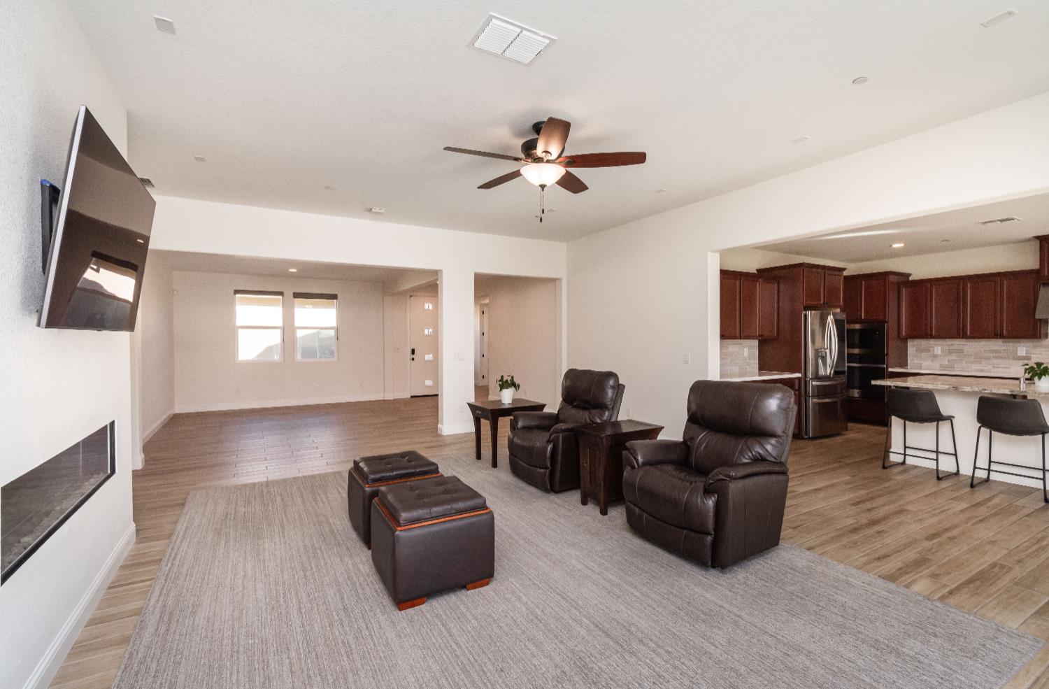 124 Basile Court Lincoln, CA 95648 - Photo 22 of 64 a living room with furniture and a wooden floor